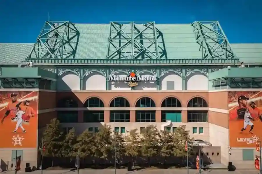 a baseball stadium with a large sign on the side of it in Minute Maid Park, Houston tx